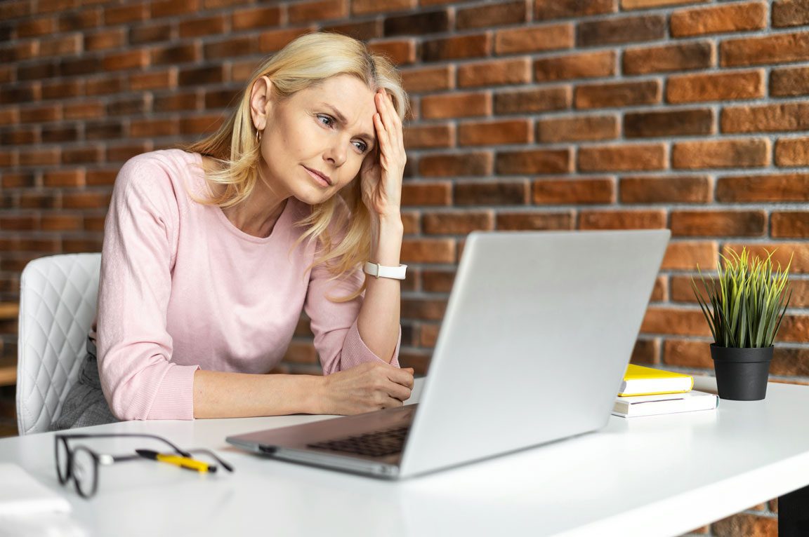 frustrated businesswoman on laptop
